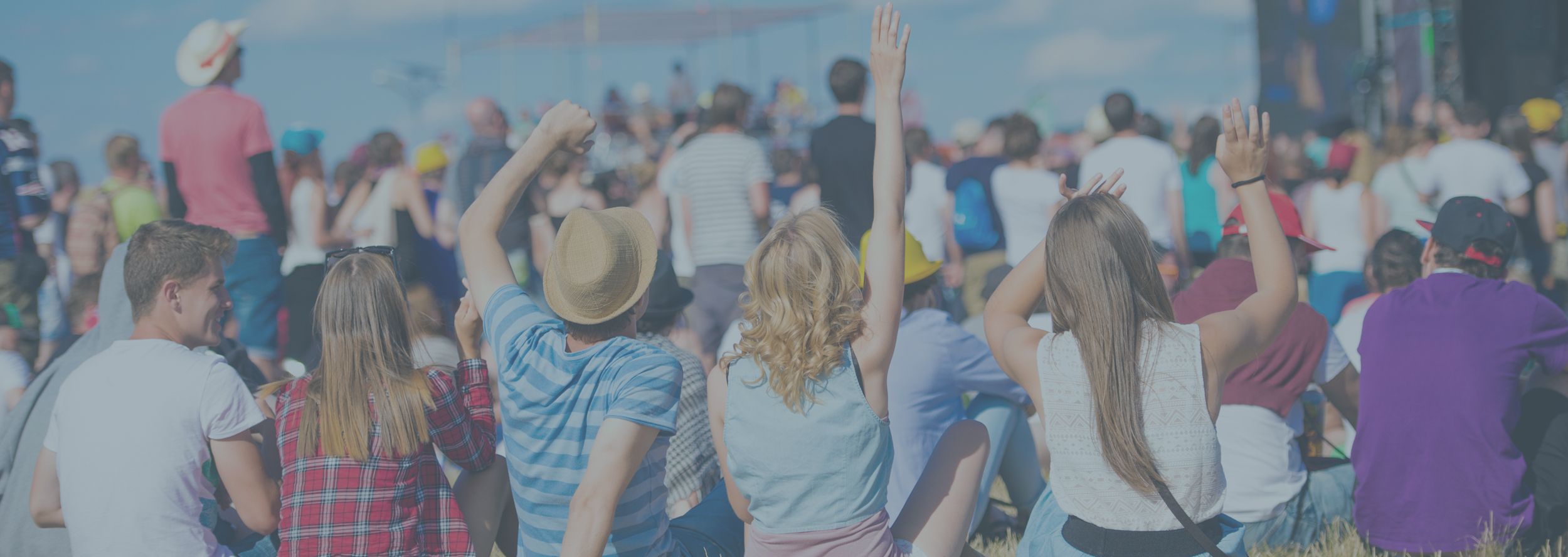 background image showing festival party with people and hand in the air