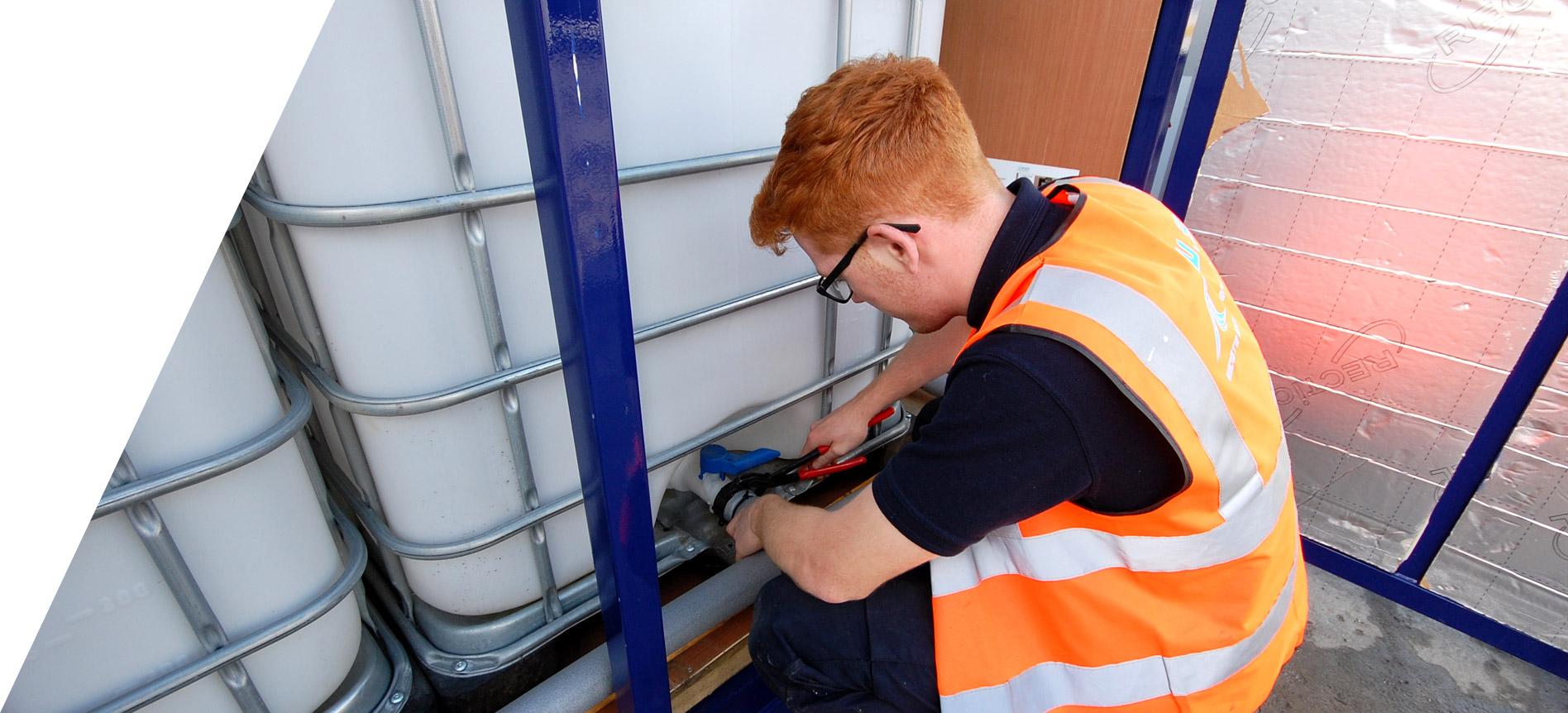 operative installing water bowser on site